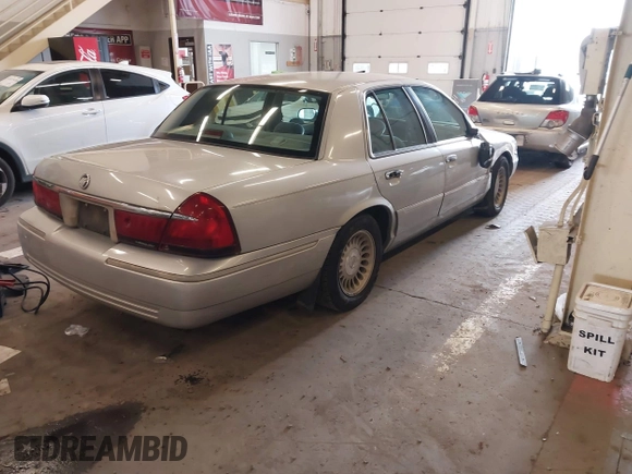 2000 Mercury Grand Marquis LS z VIN 2MEFM75W0YX736324, wystawiony jako IAAI lot #41865927 z przebiegiem 136 886 mil mil oraz . Historia ofert i sprzedaży dostępna na DreamBid. Obrazek 4.