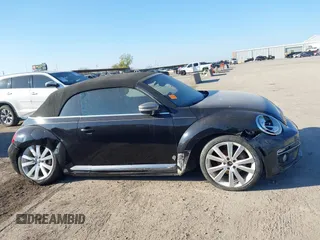 2014 Volkswagen Beetle 1.8T with VIN 3VW517AT4EM815243, listed as a IAAI auction lot 41245346 with 119,259 mi miles and . Bid and sale history available at DreamBid. Image 13.