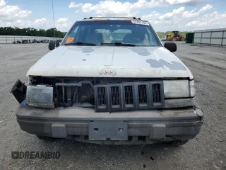 1995 Jeep Grand Cherokee Laredo с VIN 1J4GZ58S5SC724222, выставлен на аукционе Copart как лот 57837155 с пробегом 246 303 миль миль и Списание • Salvage title. История ставок и продаж доступна на DreamBid. Изображение 5.
