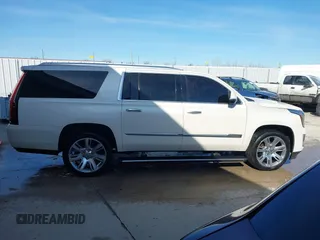2015 Cadillac Escalade ESV Premium z VIN 1GYS4TKJ9FR700022, wystawiony jako IAAI lot #41748188 z przebiegiem 166 416 mil mil oraz . Historia ofert i sprzedaży dostępna na DreamBid. Obrazek 13.