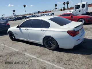 2013 BMW 7 Series 750i with VIN WBAYA8C54DC996412, listed as a Copart auction lot 56982895 with 124,258 mi miles and Salvage title. Bid and sale history available at DreamBid. Image 2.