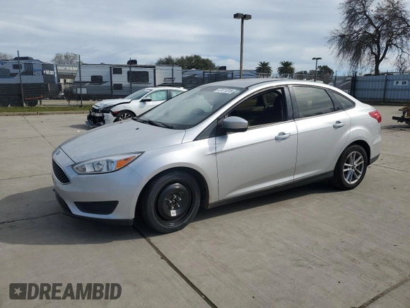 2018 Ford Focus SE with VIN 1FADP3FE3JL261145, listed as a Copart auction lot 47411315 with 98,581 mi miles and Salvage Title. Bid and sale history available at carsss.com. Image 1.