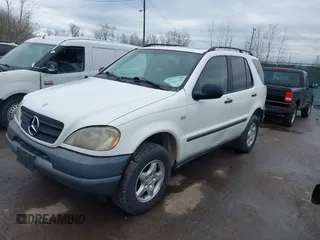 1999 Mercedes-Benz M 320/430/500 with VIN 4JGAB54E3XA141663, listed as a IAAI auction lot 41886982 with 196,503 mi miles and . Bid and sale history available at DreamBid. Image 2.