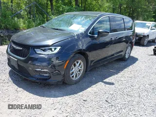 2023 Chrysler Pacifica Touring L with VIN 2C4RC1BG2PR534194, listed as a IAAI auction lot 42613934 with 69,896 mi miles and . Bid and sale history available at DreamBid. Image 2.