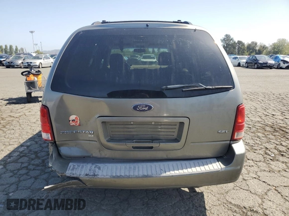 2004 Ford Freestar SEL z VIN 2FMDA522X4BA41942, wystawiony jako Copart lot #54007555 z przebiegiem 119 877 mil mil oraz Szkoda całkowita • Salvage title. Historia ofert i sprzedaży dostępna na DreamBid. Obrazek 6.