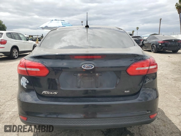 2015 Ford Focus SE with VIN 1FADP3F20FL249872, listed as a Copart auction lot 53506885 with 97,078 mi miles and Salvage title. Bid and sale history available at DreamBid. Image 6.