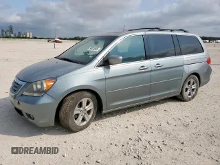 2010 Honda Odyssey Touring с VIN 5FNRL3H97AB062761, выставлен на аукционе Copart как лот 58024595 с пробегом 168 433 миль миль и Чистый • Clean title. История ставок и продаж доступна на DreamBid. Изображение 1.