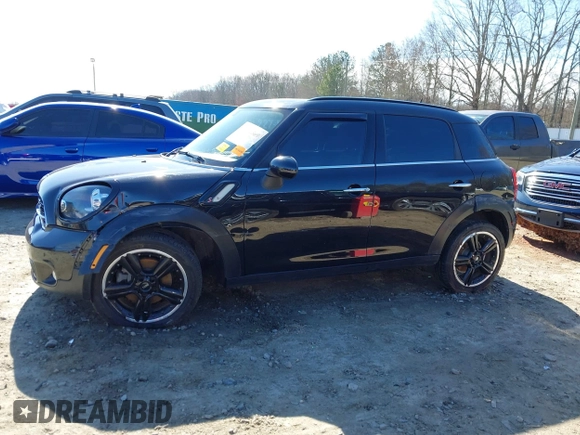 2015 MINI Countryman S with VIN WMWZC3C5XFWT04916, listed as a IAAI auction lot 41636369 with 101,448 mi miles and . Bid and sale history available at DreamBid. Image 14.