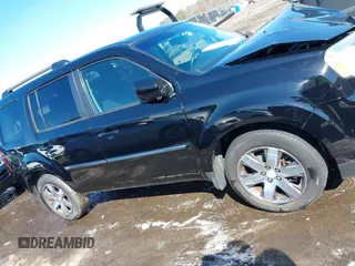 2015 Honda Pilot Touring with VIN 5FNYF3H97FB016390, listed as a IAAI auction lot 41753590 with 217,156 mi miles. Bid and sale history available at carsss.com. Image 13.