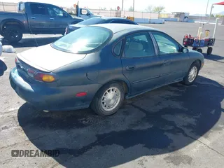 1996 Ford Taurus LX with VIN 1FALP53S0TG125665, listed as a IAAI auction lot 42290691 with 91,152 mi miles and . Bid and sale history available at DreamBid. Image 4.
