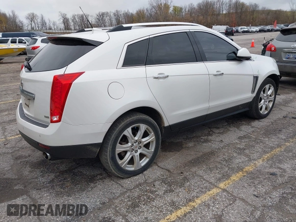 2014 Cadillac SRX Premium Collection z VIN 3GYFNDE34ES548826, wystawiony jako IAAI lot #40792942 z przebiegiem 115 984 mil mil oraz . Historia ofert i sprzedaży dostępna na DreamBid. Obrazek 4.