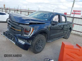 2023 Ford F-150 XL with VIN 1FTEW1E85PFC77839, listed as a IAAI auction lot 41500004 with 26,707 mi miles. Bid and sale history available at carsss.com. Image 2.