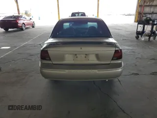 2002 Saturn SL z VIN 1G8ZH52842Z165459, wystawiony jako Copart lot #57273035 z przebiegiem 84 482 mil mil oraz Szkoda całkowita • Salvage title. Historia ofert i sprzedaży dostępna na DreamBid. Obrazek 6.