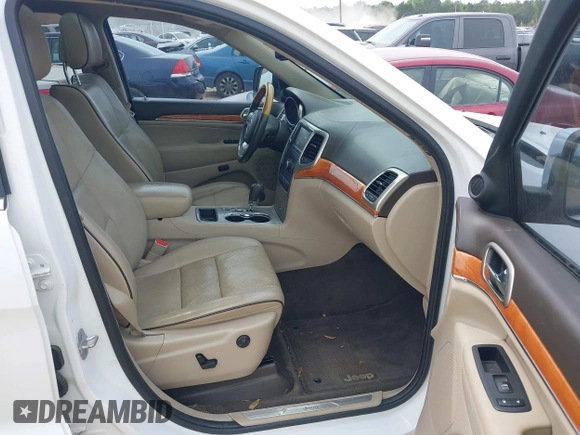 2013 Jeep Grand Cherokee Overland with VIN 1C4RJECGXDC621227, listed as a IAAI auction lot 42098042 with 194,232 mi miles and . Bid and sale history available at DreamBid. Image 5.