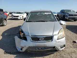 2011 Kia Rio LX with VIN KNADH4A37B6954946, listed as a Copart auction lot 52342385 with 151,984 mi miles and Salvage Title. Bid and sale history available at carsss.com. Image 5.
