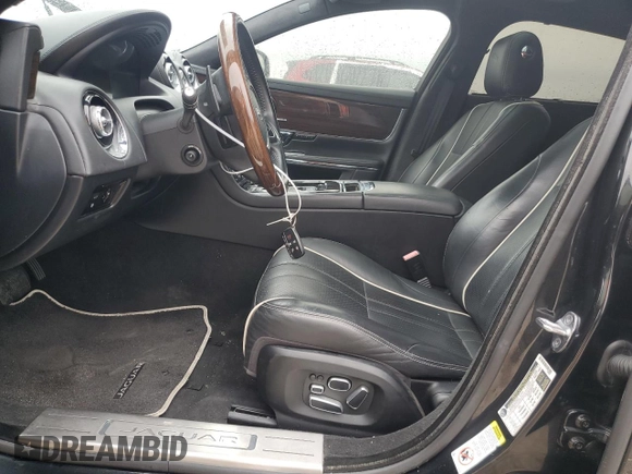 2014 Jaguar XJ Portfolio z VIN SAJWA2GZ2E8V64993, wystawiony jako Copart lot #88774965 z przebiegiem Nie podano mil oraz Szkoda całkowita • Salvage title. Historia ofert i sprzedaży dostępna na DreamBid. Obrazek 7.