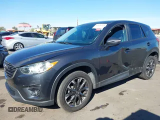 2016 Mazda CX-5 Grand Touring z VIN JM3KE2DYXG0649781, wystawiony jako IAAI lot #41636329 z przebiegiem 83 433 mil mil oraz . Historia ofert i sprzedaży dostępna na DreamBid. Obrazek 6.