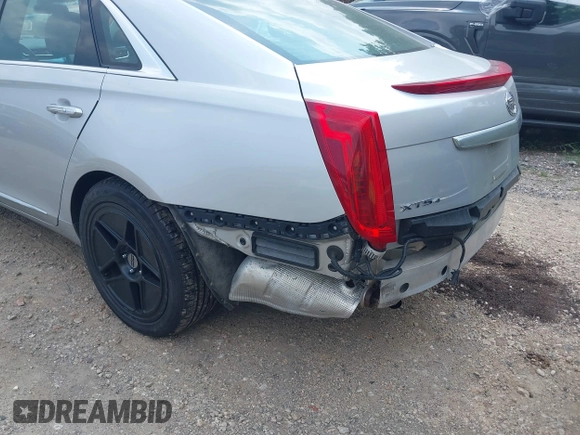 2014 Cadillac XTS Luxury z VIN 2G61N5S38E9270619, wystawiony jako IAAI lot #40140617 z przebiegiem 117 286 mil mil oraz . Historia ofert i sprzedaży dostępna na DreamBid. Obrazek 13.