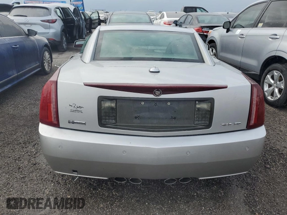 2004 Cadillac XLR z VIN 1G6YV34A545602056, wystawiony jako Copart lot #66506514 z przebiegiem Nie podano mil oraz Nie do naprawy • Non repairable. Historia ofert i sprzedaży dostępna na DreamBid. Obrazek 6.