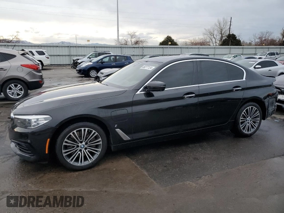 2018 BMW 5 Series 530e xDrive with VIN WBAJB1C5XJB084018, listed as a Copart auction lot 86277124 with 127,517 mi miles and Salvage Title. Bid and sale history available at carsss.com. Image 1.