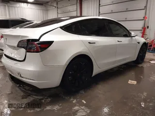 2018 Tesla Model 3 Long Range Battery with VIN 5YJ3E1EA8JF154738, listed as a IAAI auction lot 41013807 with 115,488 mi miles and . Bid and sale history available at DreamBid. Image 4.