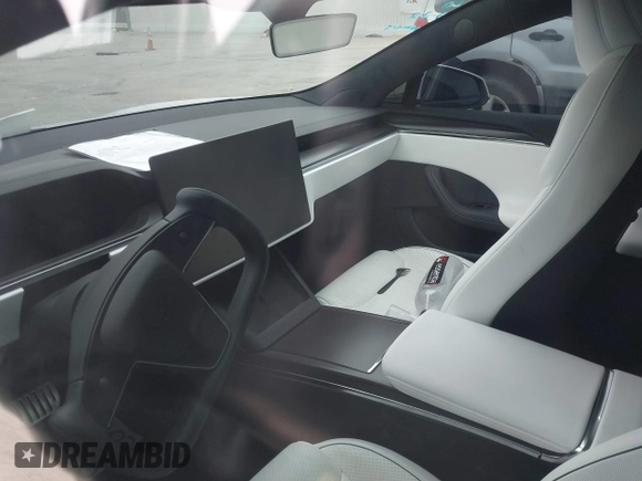 2021 Tesla Model S Plaid z VIN 5YJSA1E64MF452744, wystawiony jako IAAI lot #41375136 z przebiegiem Nie podano mil oraz . Historia ofert i sprzedaży dostępna na DreamBid. Obrazek 17.