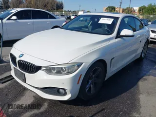 2015 BMW 4 Series 428i with VIN WBA3N7C54FK225367, listed as a IAAI auction lot 41958685 with 142,104 mi miles. Bid and sale history available at carsss.com. Image 2.