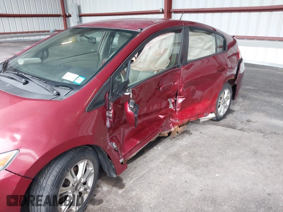 2010 Honda Insight EX with VIN JHMZE2H74AS033674, listed as a IAAI auction lot 41953858 with 144,018 mi miles and . Bid and sale history available at DreamBid. Image 6.