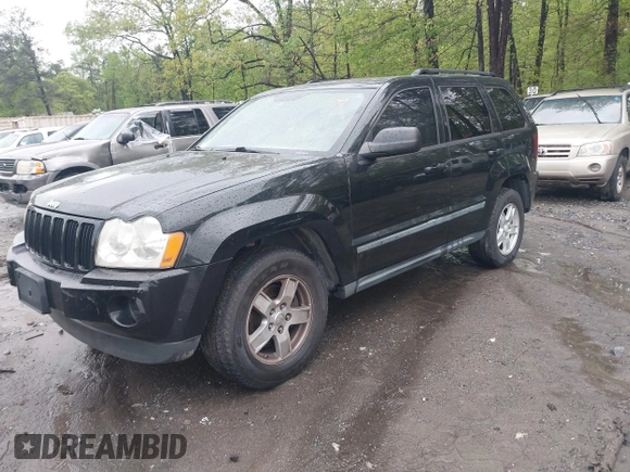 2007 Jeep Grand Cherokee Laredo with VIN 1J8GS48K57C516037, listed as a IAAI auction lot 41982692 with 273,961 mi miles. Bid and sale history available at carsss.com. Image 2.