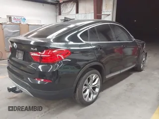 2015 BMW X4 xDrive28i z VIN 5UXXW3C59F0M87082, wystawiony jako IAAI lot #41839047 z przebiegiem 142 081 mil mil oraz . Historia ofert i sprzedaży dostępna na DreamBid. Obrazek 4.