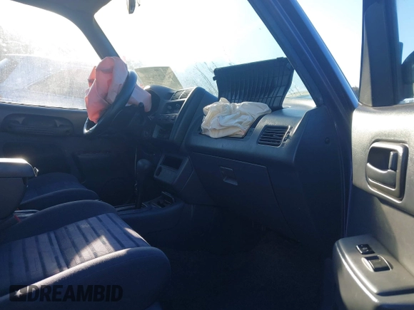1997 Toyota RAV4 with VIN JT3GP10VXV0015872, listed as a IAAI auction lot 41827830 with 314,640 mi miles and . Bid and sale history available at DreamBid. Image 5.