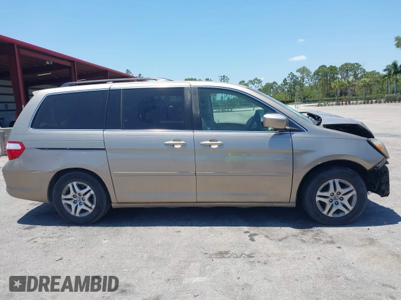 2005 Honda Odyssey EX with VIN 5FNRL38495B401742, listed as a IAAI auction lot 42133434 with 162,161 mi miles and . Bid and sale history available at carsss.com. Image 14.