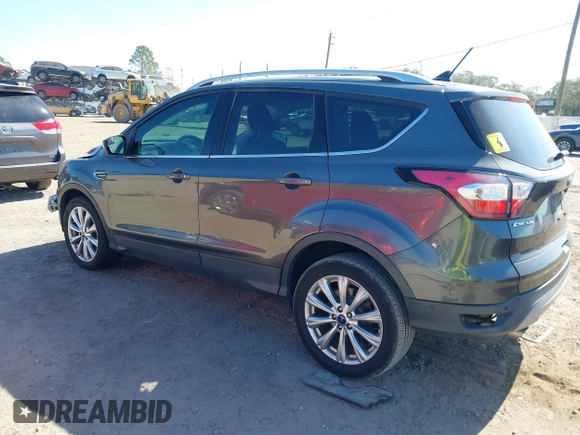 2018 Ford Escape Titanium with VIN 1FMCU0J99JUB09562, listed as a IAAI auction lot 41547659 with 63,700 mi miles and . Bid and sale history available at DreamBid. Image 3.