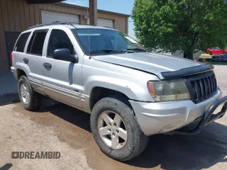 2004 Jeep Grand Cherokee Laredo with VIN 1J4GW48S74C260968, listed as a IAAI auction lot 42050628 with 192,602 mi miles. Bid and sale history available at carsss.com. Image 1.