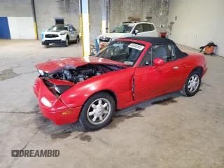 1990 Mazda MX-5 Miata z VIN JM1NA3518L0133132, wystawiony jako Copart lot #64096565 z przebiegiem 76 568 mil mil oraz Szkoda całkowita • Salvage title. Historia ofert i sprzedaży dostępna na DreamBid. Obrazek 1.