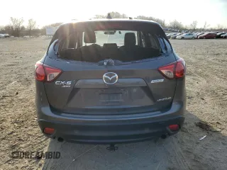 2014 Mazda CX-5 Grand Touring with VIN JM3KE4DY5E0372787, listed as a Copart auction lot 48873675 with 136,784 mi miles and Salvage Title. Bid and sale history available at carsss.com. Image 6.