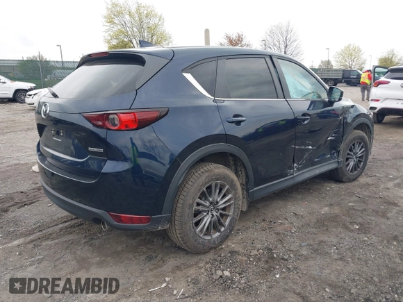 2021 Mazda CX-5 Touring with VIN JM3KFBCM1M1336457, listed as a IAAI auction lot 42034330 with 39,910 mi miles. Bid and sale history available at carsss.com. Image 4.