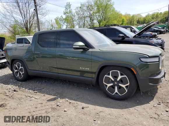 2024 Rivian R1T Adventure z VIN 7FCTGCAA1RN030829, wystawiony jako Copart lot #55557565 z przebiegiem Nie podano mil oraz Szkody całkowita. Historia ofert i sprzedaży dostępna na DreamBid. Obrazek 4.