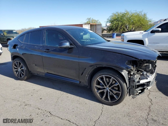 2021 BMW X4 M40i with VIN 5UX2V5C06M9E04443, listed as a Copart auction lot 72061194 with 71637 miles and Salvage Title. Bid and sale history available at carsss.com. Image 4.