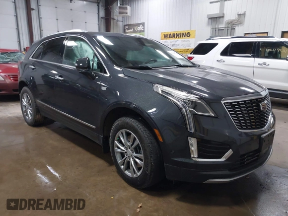 2023 Cadillac XT5 AWD Premium Luxury with VIN 1GYKNDRS2PZ122350, listed as a IAAI auction lot 42123718 with 17,971 mi miles and . Bid and sale history available at DreamBid. Image 1.