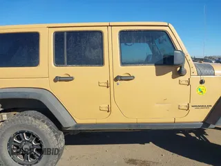 2013 Jeep Wrangler Unlimited Rubicon with VIN 1C4BJWFG3DL632668, listed as a IAAI auction lot 41751546 with 153,149 mi miles. Bid and sale history available at carsss.com. Image 12.