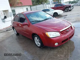 2004 Kia Spectra LX with VIN KNAFE121545021648, listed as a IAAI auction lot 41842471 with 211,436 mi miles. Bid and sale history available at carsss.com. Image 1.