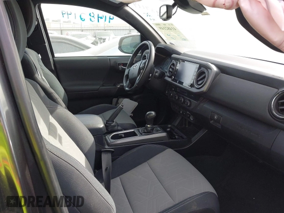 2022 Toyota Tacoma SR with VIN 3TMCZ5AN4NM476170, listed as a IAAI auction lot 41482149 with 57,126 mi miles and . Bid and sale history available at DreamBid. Image 5.