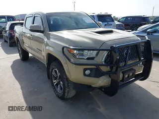 2019 Toyota Tacoma SR with VIN 3TMCZ5AN8KM208864, listed as a IAAI auction lot 42596165 with 71,262 mi miles and . Bid and sale history available at DreamBid. Image 1.