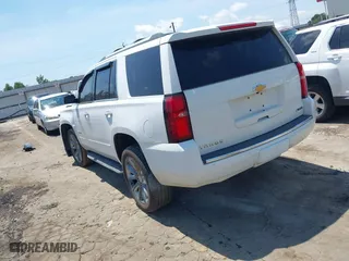 2018 Chevrolet Tahoe Premier with VIN 1GNSCCKCXJR324733, listed as a IAAI auction lot 40102147 with 119,134 mi miles. Bid and sale history available at carsss.com. Image 3.