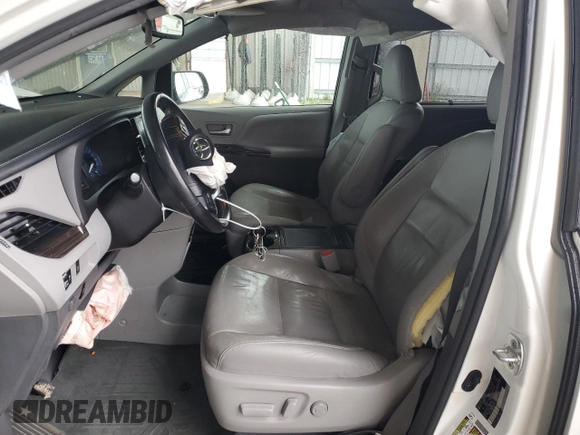 2016 Toyota Sienna XLE with VIN 5TDYK3DC8GS729616, listed as a Copart auction lot 59748995 with 144,469 mi miles and Salvage title. Bid and sale history available at DreamBid. Image 7.