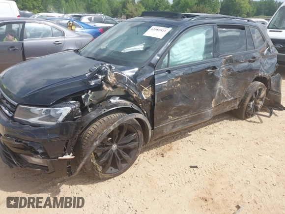 2021 Volkswagen Tiguan SE z VIN 3VV3B7AX5MM027369, wystawiony jako IAAI lot #42082821 z przebiegiem 74 024 mil mil oraz . Historia ofert i sprzedaży dostępna na DreamBid. Obrazek 6.