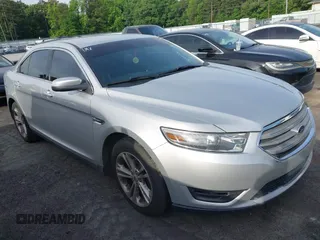2014 Ford Taurus SEL z VIN 1FAHP2E82EG132710, wystawiony jako IAAI lot #42240232 z przebiegiem 244 094 mil mil oraz . Historia ofert i sprzedaży dostępna na DreamBid. Obrazek 1.