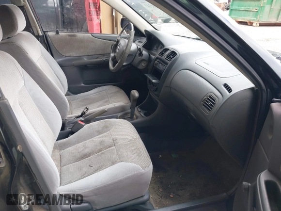 2000 Mazda Protege DX with VIN JM1BJ2227Y0303448, listed as a IAAI auction lot 41482747 with 206,542 mi miles and . Bid and sale history available at DreamBid. Image 5.