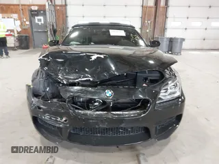 2014 BMW M6 z VIN WBSLZ9C58EDZ78401, wystawiony jako IAAI lot #41840114 z przebiegiem 23 499 mil mil oraz . Historia ofert i sprzedaży dostępna na DreamBid. Obrazek 12.